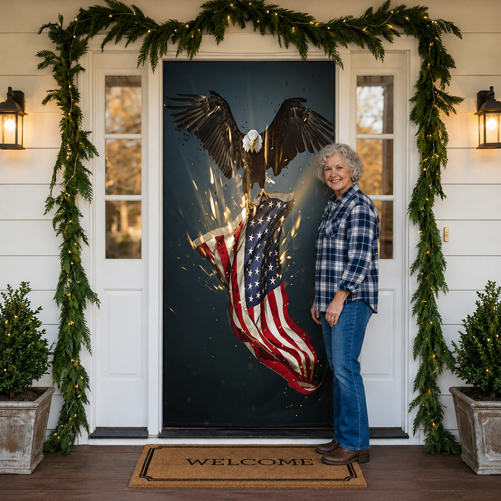 Woman standing in front of a front door covered with a DoorFoto with an eagle and American flag design, flanked by Christmas garlands.